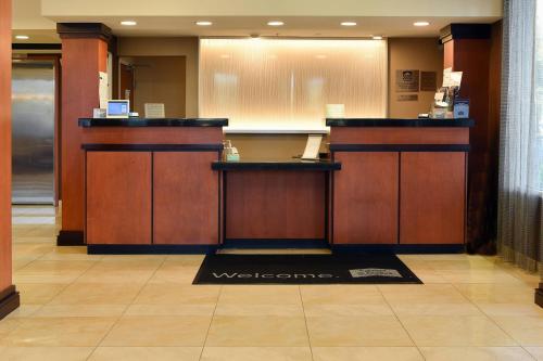 a lobby with a welcome counter in a building at Fairfield Inn Hartford Airport in Windsor Locks