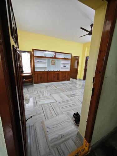 a room with a large tile floor with a ceiling at House-of-G 3bhk newly painted flat in AVA road Rajahmundry in Godāvari