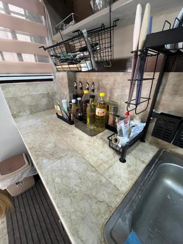 a kitchen counter with a sink and a tub at CAVR Building in Tarlac