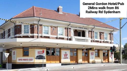 a building on the corner of a street at Stylish Queen Room 1Min Walk to Station 5Min to City 10Min to Airport in Sydney