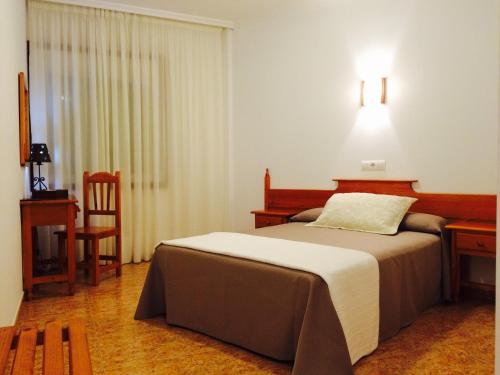 Posteľ alebo postele v izbe v ubytovaní Hostal Eden