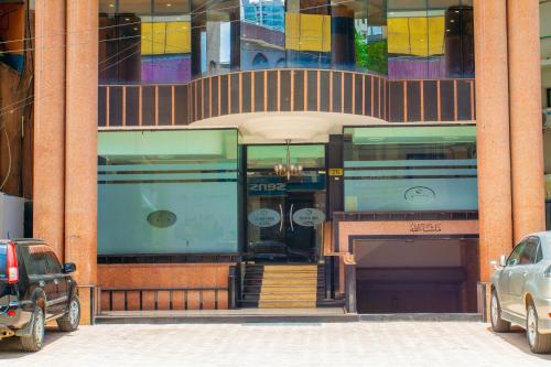 a building with a door and stairs in it at Sleep Inn Hotel - City Centre in Dar es Salaam