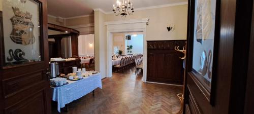 a living room with a room with a room at Gościniec & SPA Darłowo in Darłowo