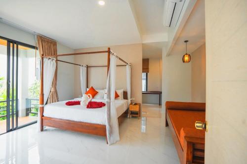 Ένα ή περισσότερα κρεβάτια σε δωμάτιο στο BeachHouse Pool Villas Krabi