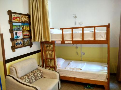 Postel nebo postele na pokoji v ubytování Haikou Banana Hostel