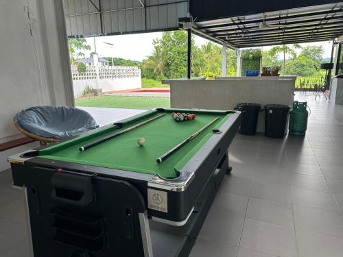 a pool table with cue balls on top of it at Sapa pool villa in Loei