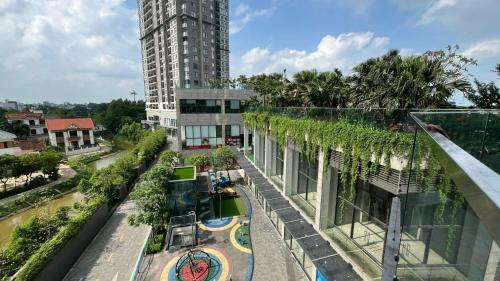 an overhead view of a building with a pool at Củi Homestay Oasis Ecopark in Kim Quan