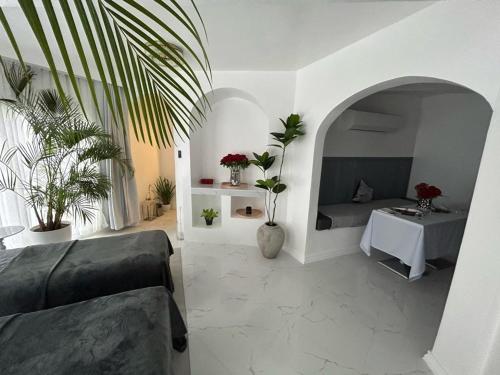 a living room with a couch and a table with plants at Scenery Resort & Spa in Tagaytay