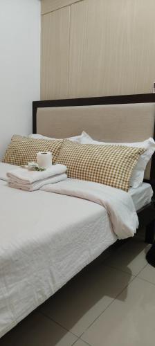 Katil atau katil-katil dalam bilik di Jazz Apartment Unit