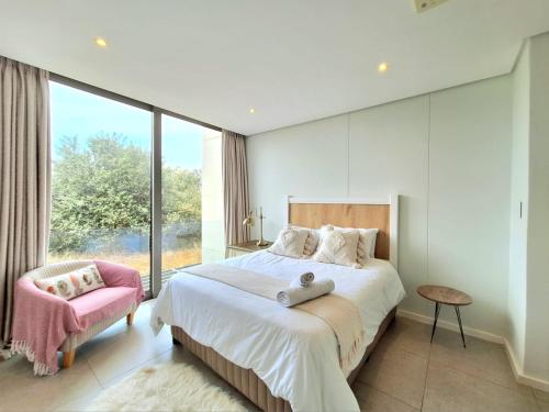 Postel nebo postele na pokoji v ubytování Ocean Dune Sibaya