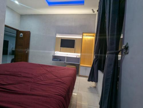Кровать или кровати в номере Hotel Agro Tawangmangu