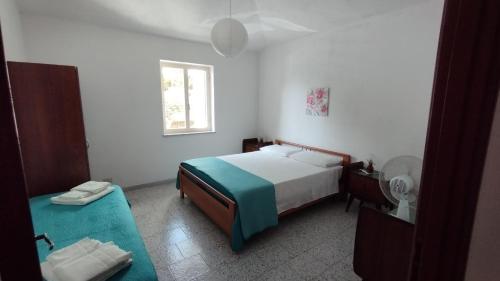 Ένα ή περισσότερα κρεβάτια σε δωμάτιο στο Villa Bianca