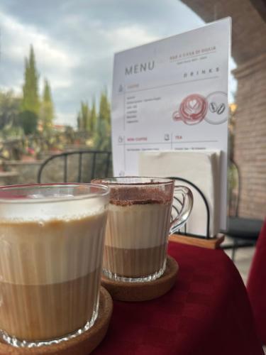 two cups of coffee sitting on top of a table at B&B A casa di Giulia in Guidonia
