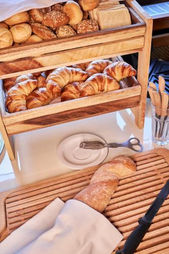 a bunch of different types of breads and pastries at Landhotel Traube in Baden-Baden