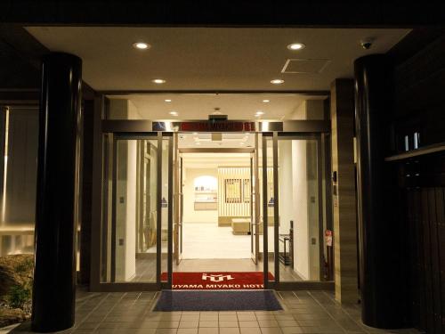 an entrance to a building with a sign on the door at Inuyama Miyako Hotel in Inuyama