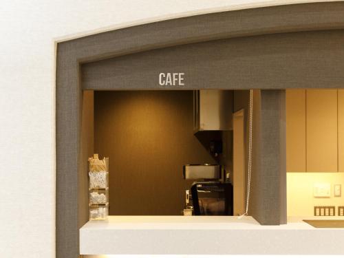 a view of a kitchen through a window at Inuyama Miyako Hotel in Inuyama