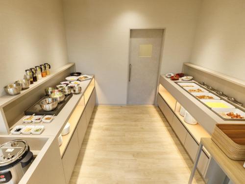 a kitchen with several counters with pots and pans at Inuyama Miyako Hotel in Inuyama