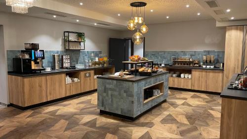 Příslušenství pro přípravu čaje a kávy v ubytování Dom-Hotel
