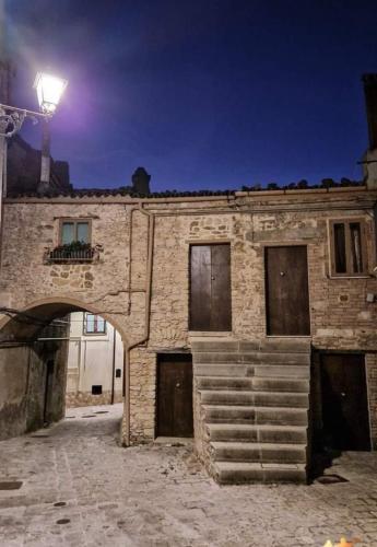 an old brick building with a light on top at All'Arco Casa Vacanza in Acerenza