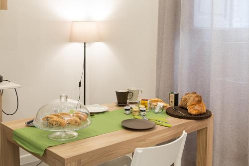 a table with a plate of food on it at l'angolo di Frima in Matera