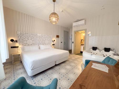 Ein Bett oder Betten in einem Zimmer der Unterkunft Akla Hotel Badajoz