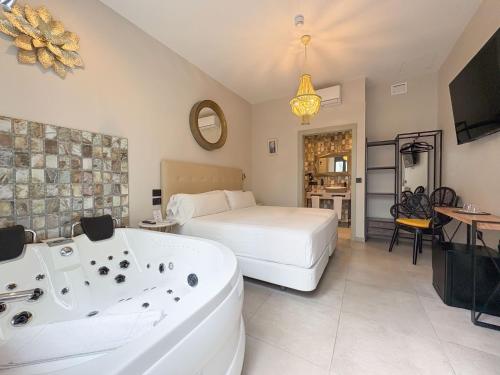 Ein Bett oder Betten in einem Zimmer der Unterkunft Akla Hotel Badajoz