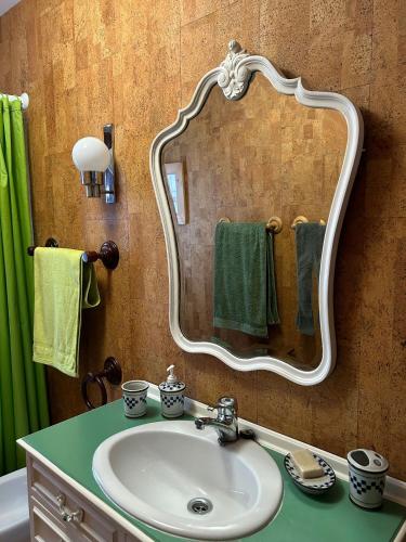 a bathroom with a sink and a mirror at GEODA Fornillos -Refugio en los Arribes del Duero in Fornillos de Fermoselle