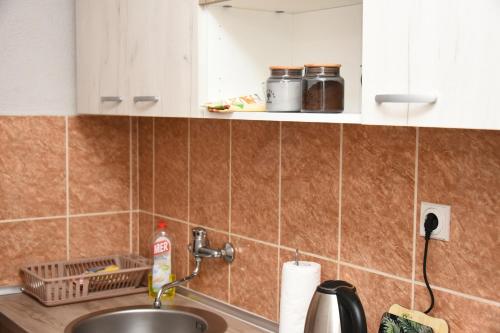 a kitchen with a sink and a counter top at Vikendica Čeperković #1 in Kopaonik