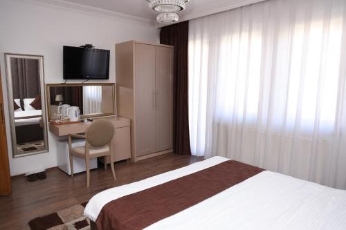 Postel nebo postele na pokoji v ubytování Hotel Cleon