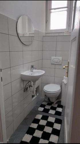 a bathroom with a sink and a toilet at FG barış Hostel in Sarajevo