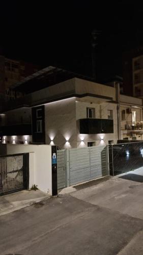 a parking meter in front of a house at night at Luxury Beach House in Bari