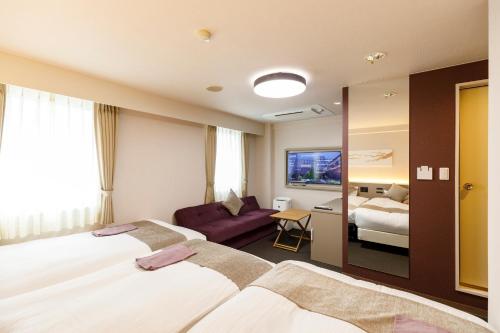 Postel nebo postele na pokoji v ubytování Inuyama Miyako Hotel