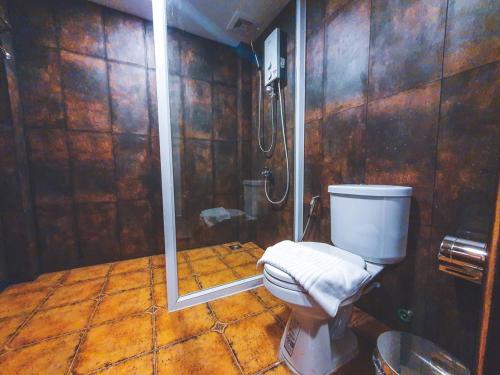 a bathroom with a toilet and a shower at Moly Resort in Kampot