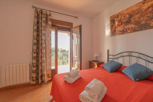 Postel nebo postele na pokoji v ubytování Casa Mirador de los Tomillos