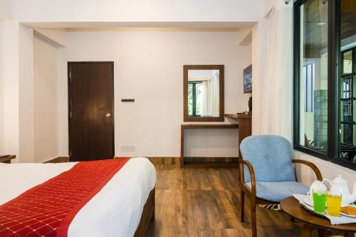 Ένα ή περισσότερα κρεβάτια σε δωμάτιο στο Sparrow Cherry Resort 2 min walk To MG Marg