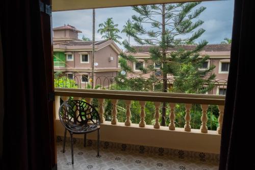 a balcony with a view of a building at Vistar Holidays in Goa