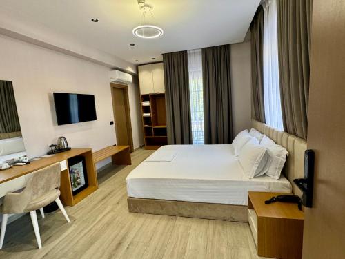 TV a/nebo společenská místnost v ubytování Residence Inn Tirana