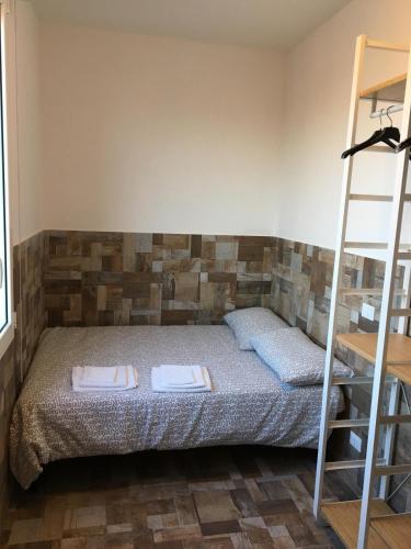 a bedroom with a bed with two trays on it at Ducati 8 Studio in Bologna