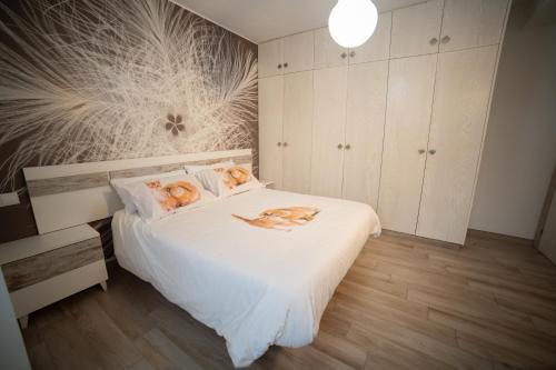a bedroom with a bed with two dogs on it at Casa El Nacimiento in Guadix