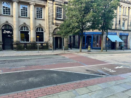 an empty street in front of a building at Airrose two bed apartment in Wolverhampton