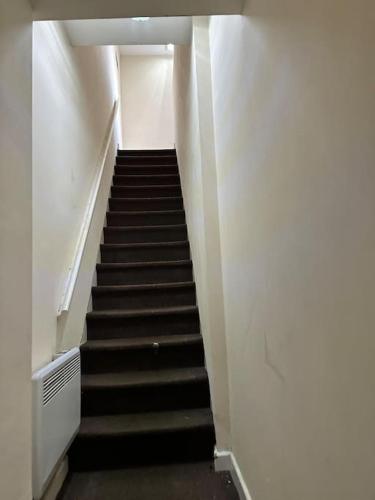 a staircase in a building with a stair case at Airrose two bed apartment in Wolverhampton