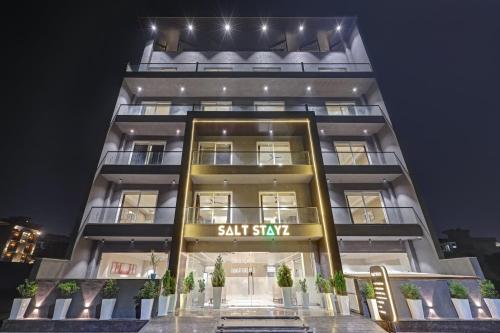 a tall building with a sign that reads salt stay at Saltstayz Premier - Golf Course Road & Sector 42 in Gurgaon