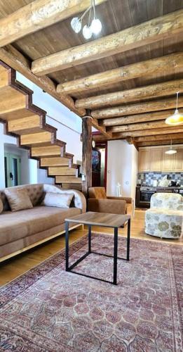 a living room with a couch and a table at Vista Del Mar Mansion in Spile