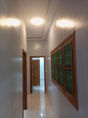 a hallway of a house with a door and a window at Appartement meublé de standing - 2 Chambres in Abomey-Calavi
