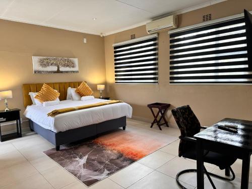 Ένα ή περισσότερα κρεβάτια σε δωμάτιο στο Fusion House B&B and Conference Venue