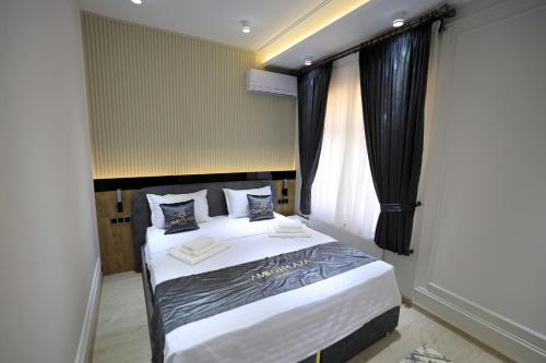 Кровать или кровати в номере AMIR PLAZA hotel