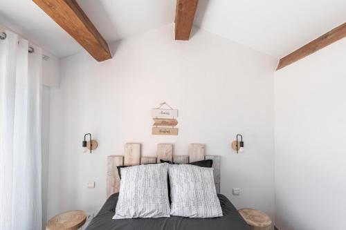 Ένα ή περισσότερα κρεβάτια σε δωμάτιο στο Appartement Les pieds dans l eau