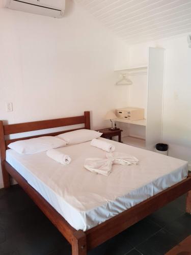 Giường trong phòng chung tại Maresias de Itu Suites pertissimo da praia com piscina