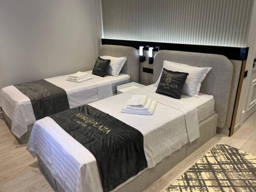 Кровать или кровати в номере AMIR PLAZA hotel
