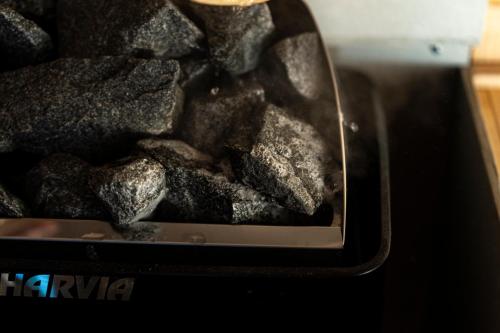 a pile of coal in a toaster oven at log&sauna 和 - nagomi, wakayama - in Kinokawa